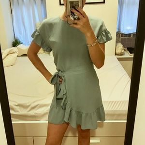 light blue wrap dress with ruffle details